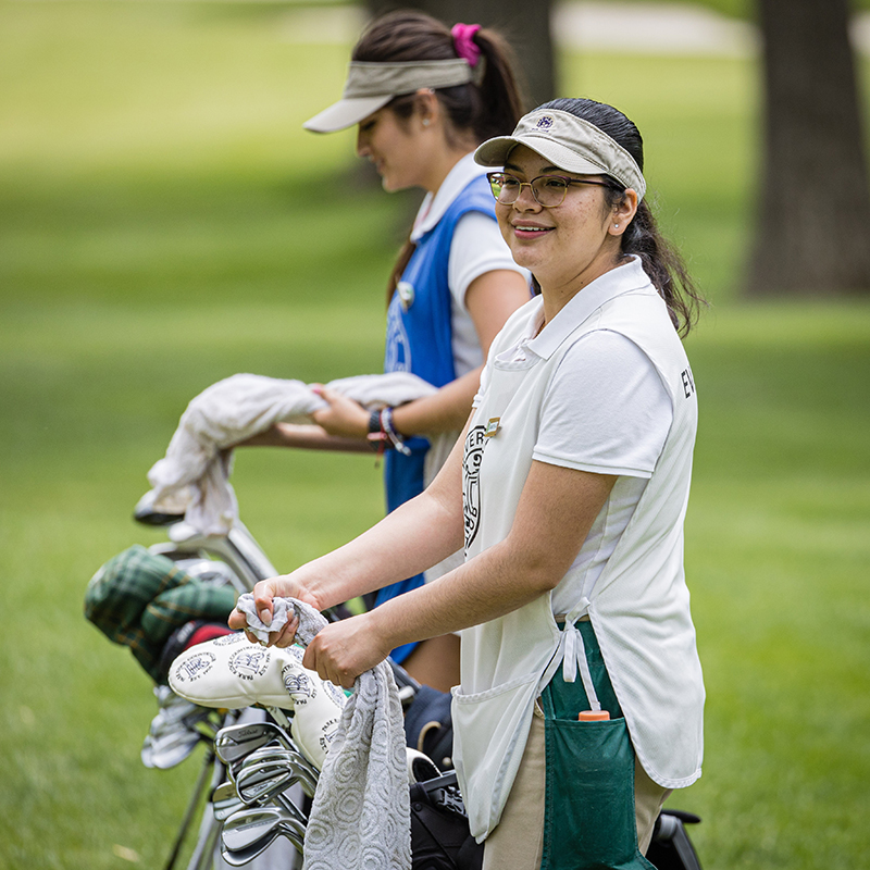 Caddies on the tee